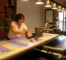 Me (Peg) in action with the longarm machine.